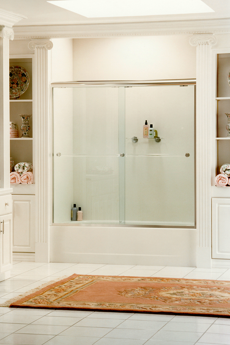 White bathroom with heavy shower doors